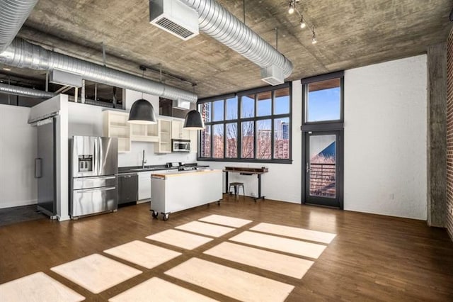 kitchen featuring dark wood-style floors, open shelves, stainless steel appliances, visible vents, and white cabinets