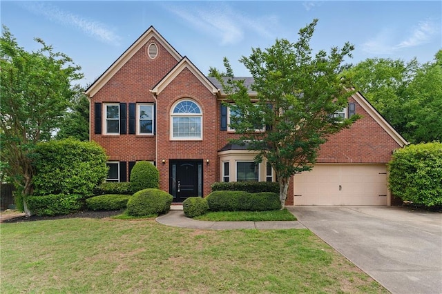 2154 Marne Gln NW, Kennesaw, GA 30152 - colonial house featuring driveway, a front yard, brick siding, and an attached garage