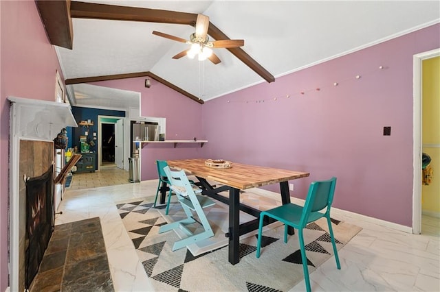 5360 Fieldgreen Dr, Stone Mountain, GA 30088 - dining room featuring light marble finish flooring, ceiling fan, lofted ceiling, and a warm lit fireplace