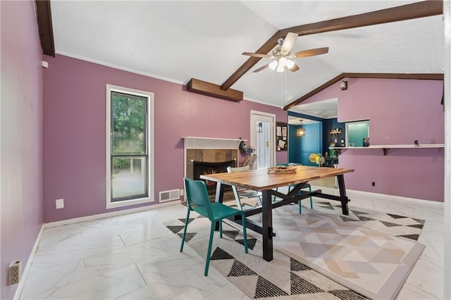 5360 Fieldgreen Dr, Stone Mountain, GA 30088 - dining area with light marble finish flooring, ceiling fan, a fireplace, and crown molding