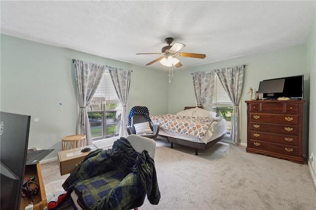 5360 Fieldgreen Dr, Stone Mountain, GA 30088 - carpeted bedroom with multiple windows and a ceiling fan