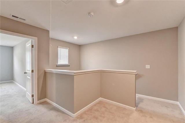 hallway with light carpet