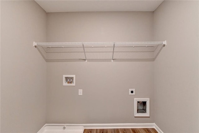 clothes washing area featuring washer hookup, hookup for an electric dryer, and hardwood / wood-style floors