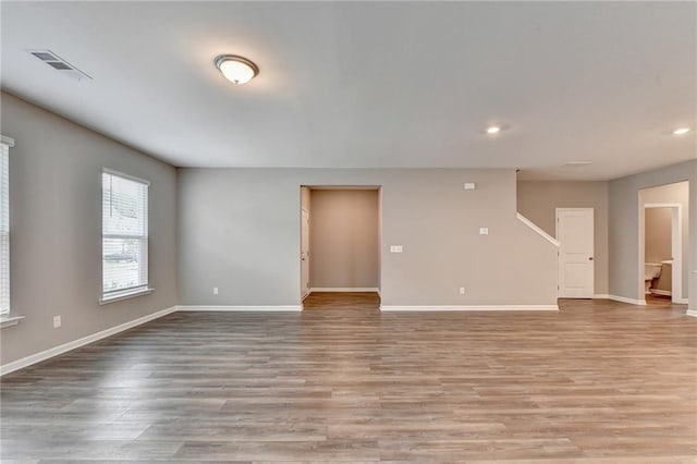 spare room featuring light wood-type flooring