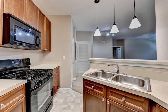 3500 Sweetwater Rd Unit 522, Duluth, GA 30096 - kitchen with black appliances, light countertops, a sink, decorative light fixtures, and baseboards
