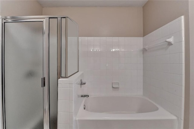 3500 Sweetwater Rd Unit 522, Duluth, GA 30096 - bathroom featuring a stall shower and a tub