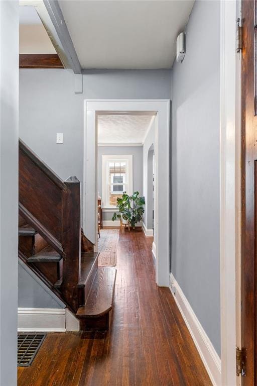 hallway featuring dark hardwood / wood-style floors