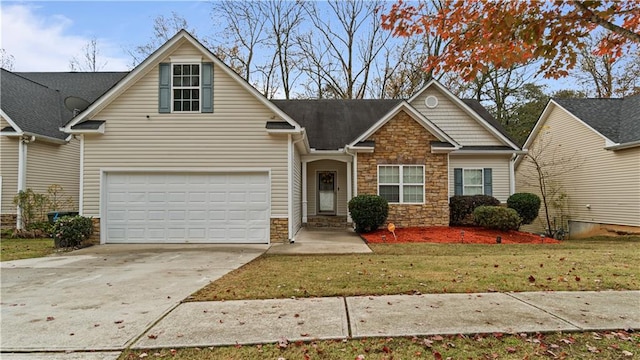 view of front of property featuring a garage and a front lawn