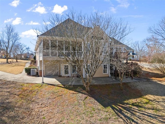 back of property featuring central AC and a patio area