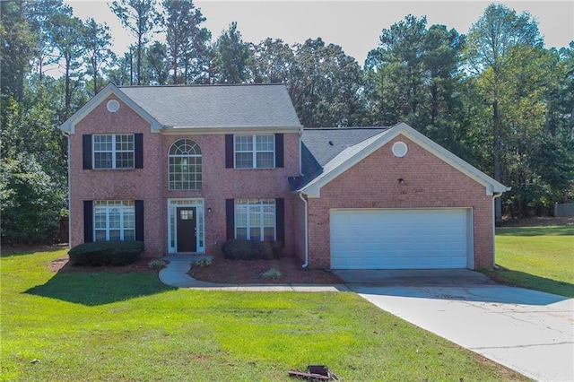 colonial home with a front lawn and a garage