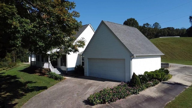 view of front facade with a garage and a front lawn