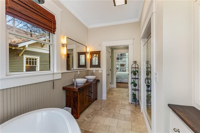 bathroom with vanity, ornamental molding, an enclosed shower, and wooden walls