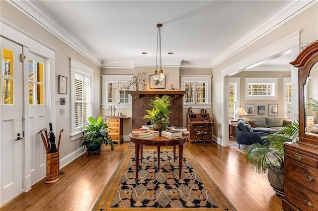 dining room featuring hardwood / wood-style floors and crown molding