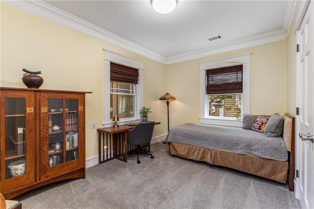 carpeted bedroom featuring crown molding