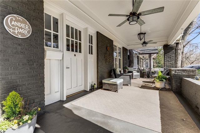 view of patio with ceiling fan and a porch