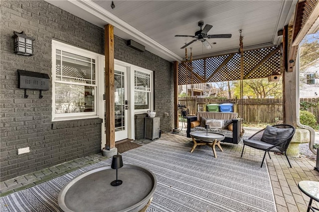 deck featuring an outdoor hangout area and ceiling fan