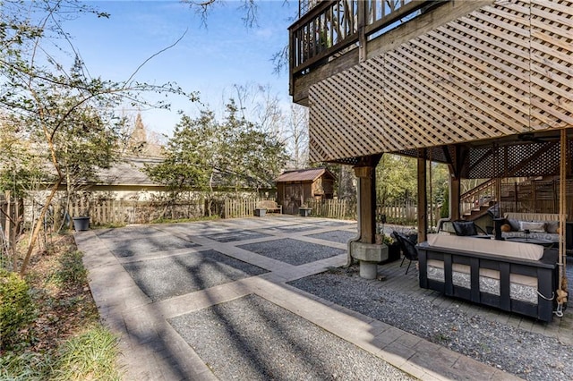 view of patio / terrace with a storage shed and outdoor lounge area