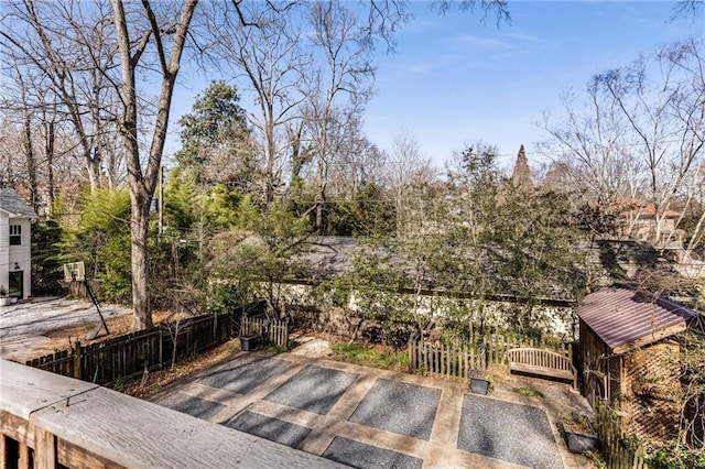 wooden terrace with a patio area