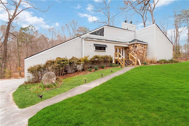 2125 Datona Dr SW, Atlanta, GA 30331 - view of front of home featuring a chimney, a front yard, and french doors