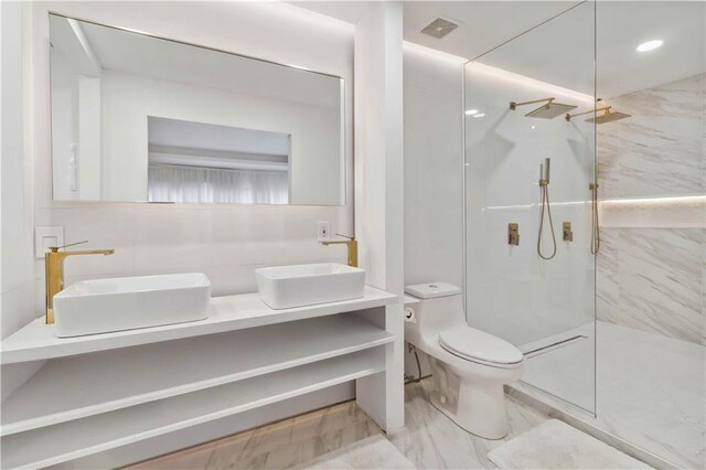 2125 Datona Dr SW, Atlanta, GA 30331 - bathroom featuring double vanity, a marble finish shower, and toilet