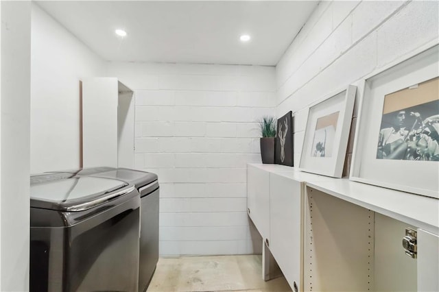 2125 Datona Dr SW, Atlanta, GA 30331 - laundry room with washer and dryer, concrete block wall, and recessed lighting