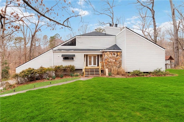 2125 Datona Dr SW, Atlanta, GA 30331 - mid-century home with a front yard, french doors, and stone siding