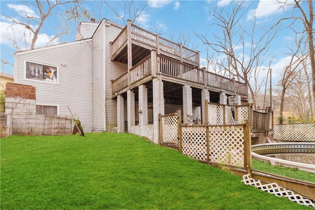 2125 Datona Dr SW, Atlanta, GA 30331 - rear view of house featuring a deck and a yard