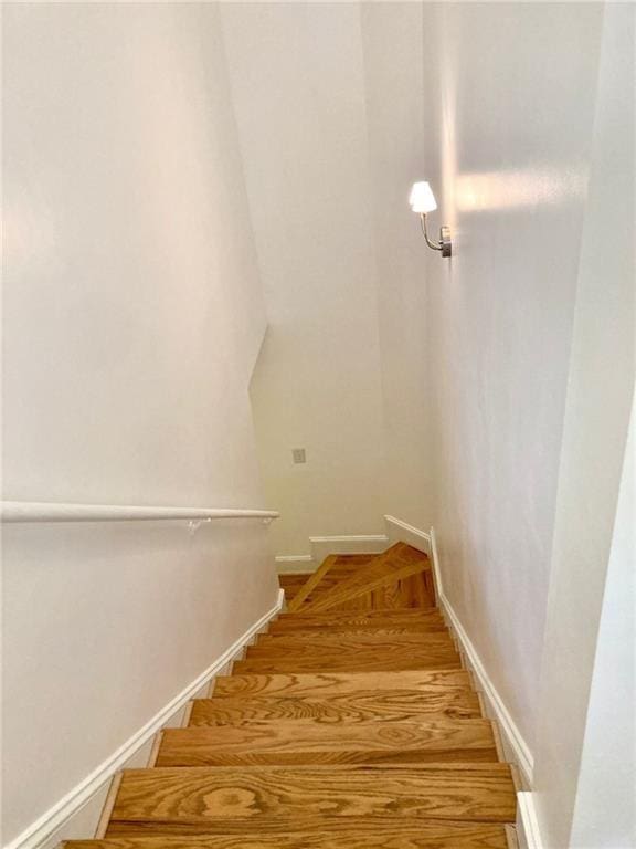 staircase featuring baseboards