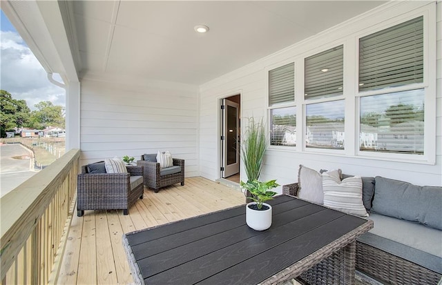 wooden deck featuring an outdoor living space