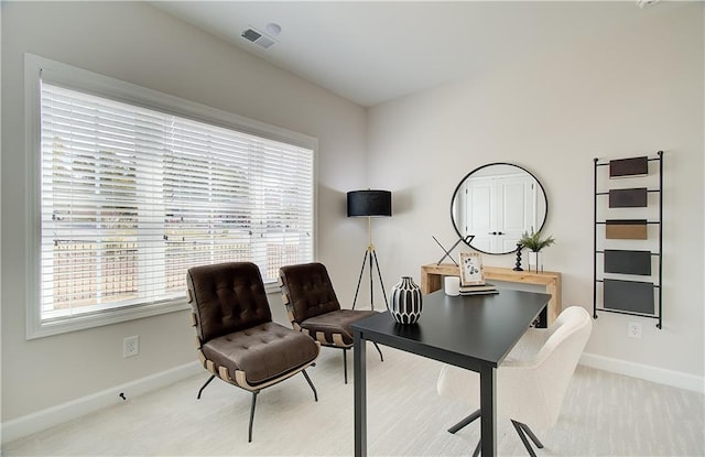 office space with visible vents and baseboards