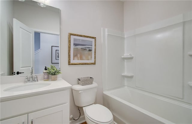 bathroom featuring vanity, toilet, and shower / washtub combination