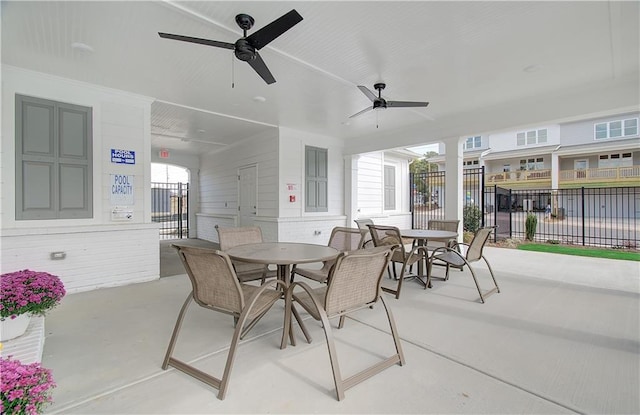 view of patio / terrace with outdoor dining area, a ceiling fan, and fence