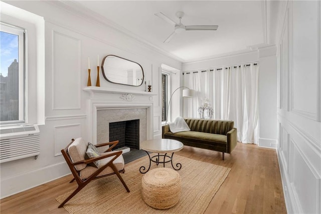 75 Ponce De Leon Ave NE Unit 1006, Atlanta, GA 30308 - living area with ceiling fan, ornamental molding, wood finished floors, a brick fireplace, and cooling unit
