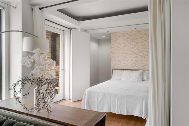 75 Ponce De Leon Ave NE Unit 1006, Atlanta, GA 30308 - bedroom with access to outside and wood finished floors