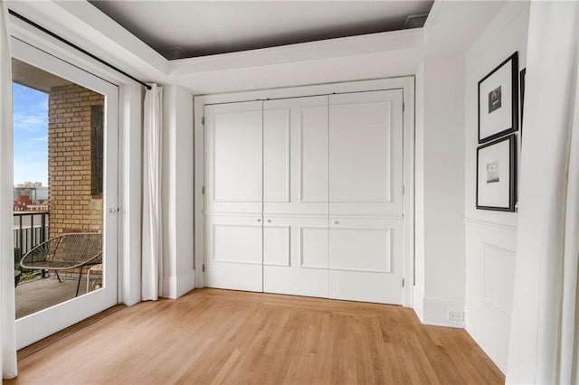 75 Ponce De Leon Ave NE Unit 1006, Atlanta, GA 30308 - unfurnished bedroom with access to outside and light wood-style floors