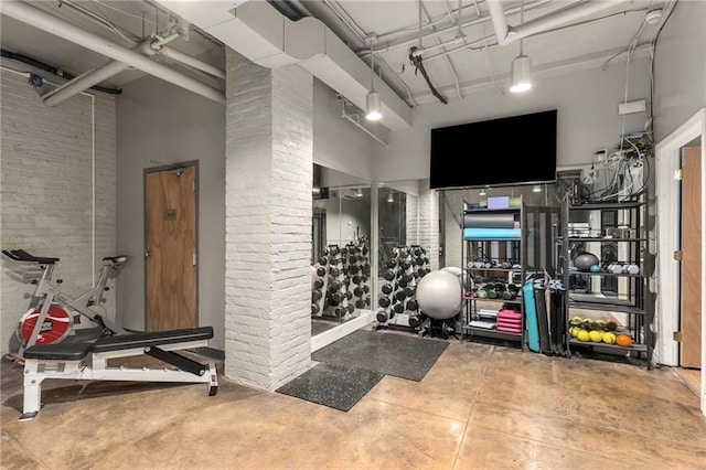75 Ponce De Leon Ave NE Unit 1006, Atlanta, GA 30308 - workout area with a towering ceiling and brick wall