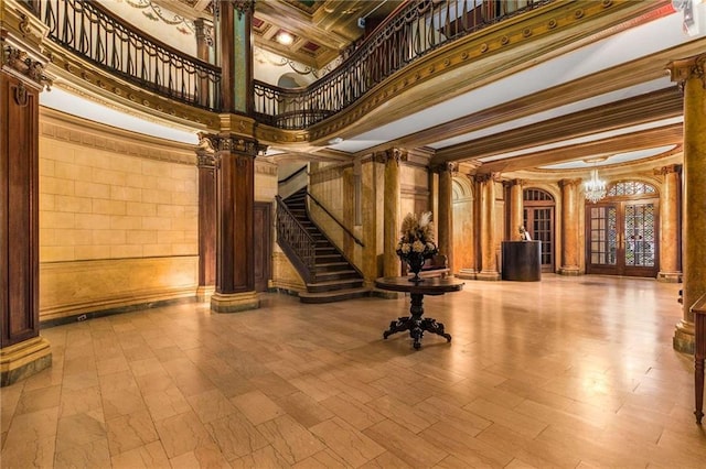 75 Ponce De Leon Ave NE Unit 1006, Atlanta, GA 30308 - community lobby with a high ceiling, stairway, and crown molding