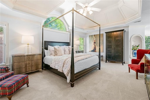 bedroom with crown molding, light carpet, and coffered ceiling