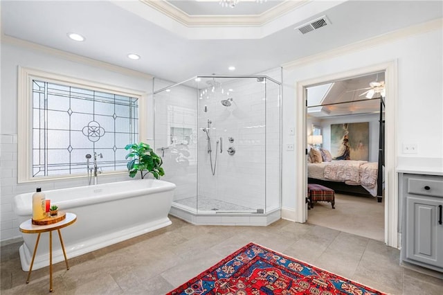 ensuite bathroom featuring crown molding, a stall shower, tile patterned floors, a freestanding tub, and recessed lighting
