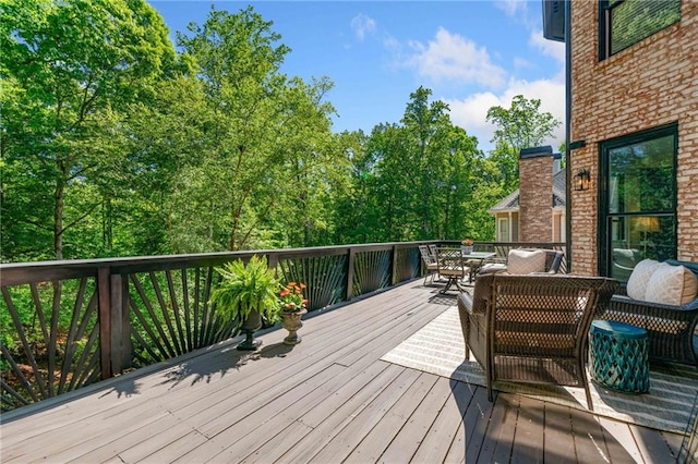 wooden deck with outdoor dining area