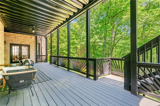 wooden deck featuring french doors, ceiling fan, and stairway