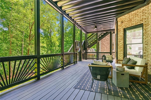 sunroom with an outdoor living space
