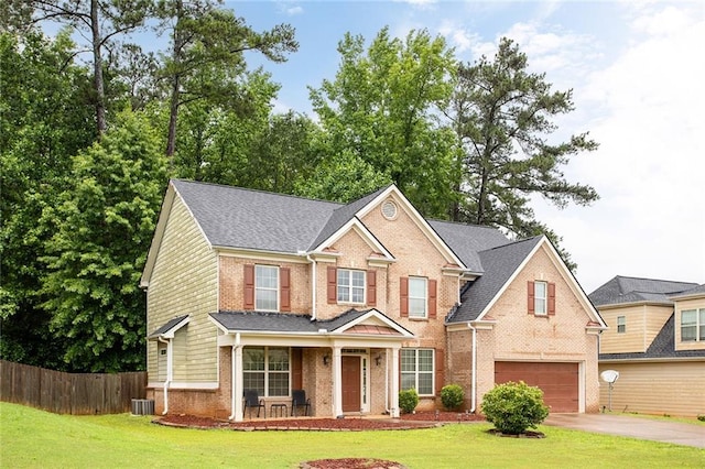 1110 Cureton Dr, Austell, GA 30106 - traditional-style house featuring brick siding, a garage, a porch, concrete driveway, and central AC unit