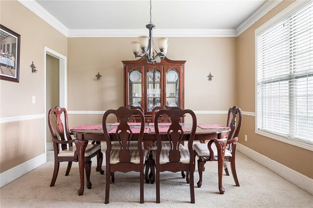 1110 Cureton Dr, Austell, GA 30106 - dining space featuring a chandelier, ornamental molding, light colored carpet, and baseboards
