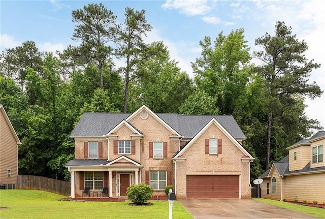 1110 Cureton Dr, Austell, GA 30106 - traditional-style home with a garage, brick siding, driveway, and covered porch