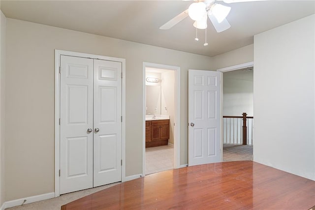 1110 Cureton Dr, Austell, GA 30106 - unfurnished bedroom featuring baseboards, ensuite bath, a ceiling fan, and a closet