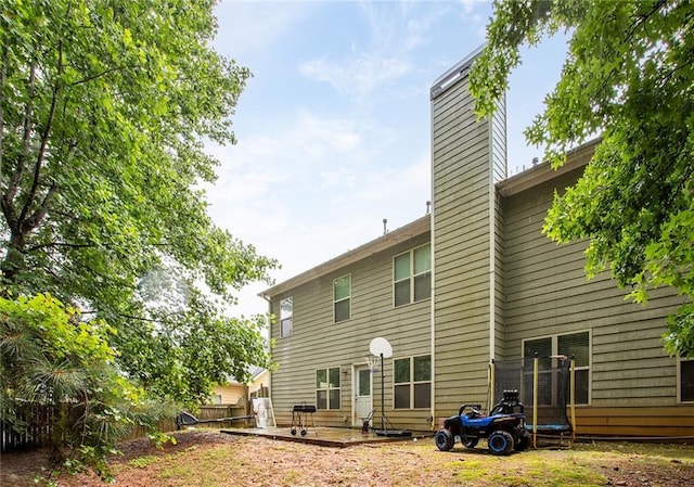 1110 Cureton Dr, Austell, GA 30106 - rear view of property featuring a chimney and a patio area