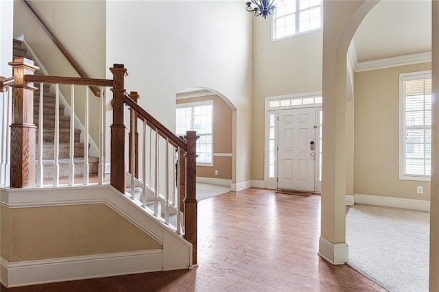 1110 Cureton Dr, Austell, GA 30106 - foyer entrance featuring arched walkways, healthy amount of natural light, crown molding, and a towering ceiling