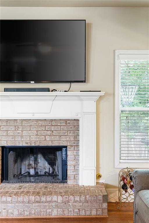 1110 Cureton Dr, Austell, GA 30106 - detailed view of a fireplace, wood finished floors, and baseboards