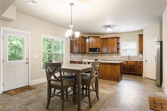 1110 Cureton Dr, Austell, GA 30106 - dining space featuring a chandelier and baseboards